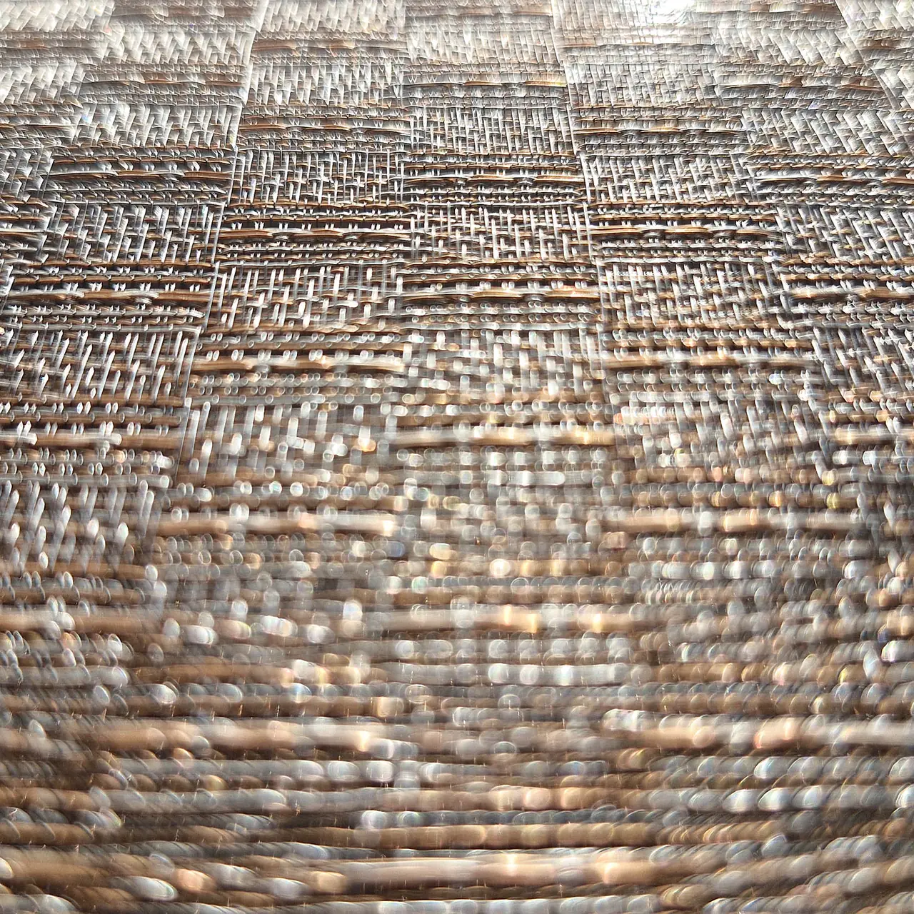 Close-up of a woven metal surface