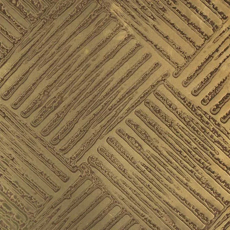 Close-up of the pattern in brass Liquid Metal relief